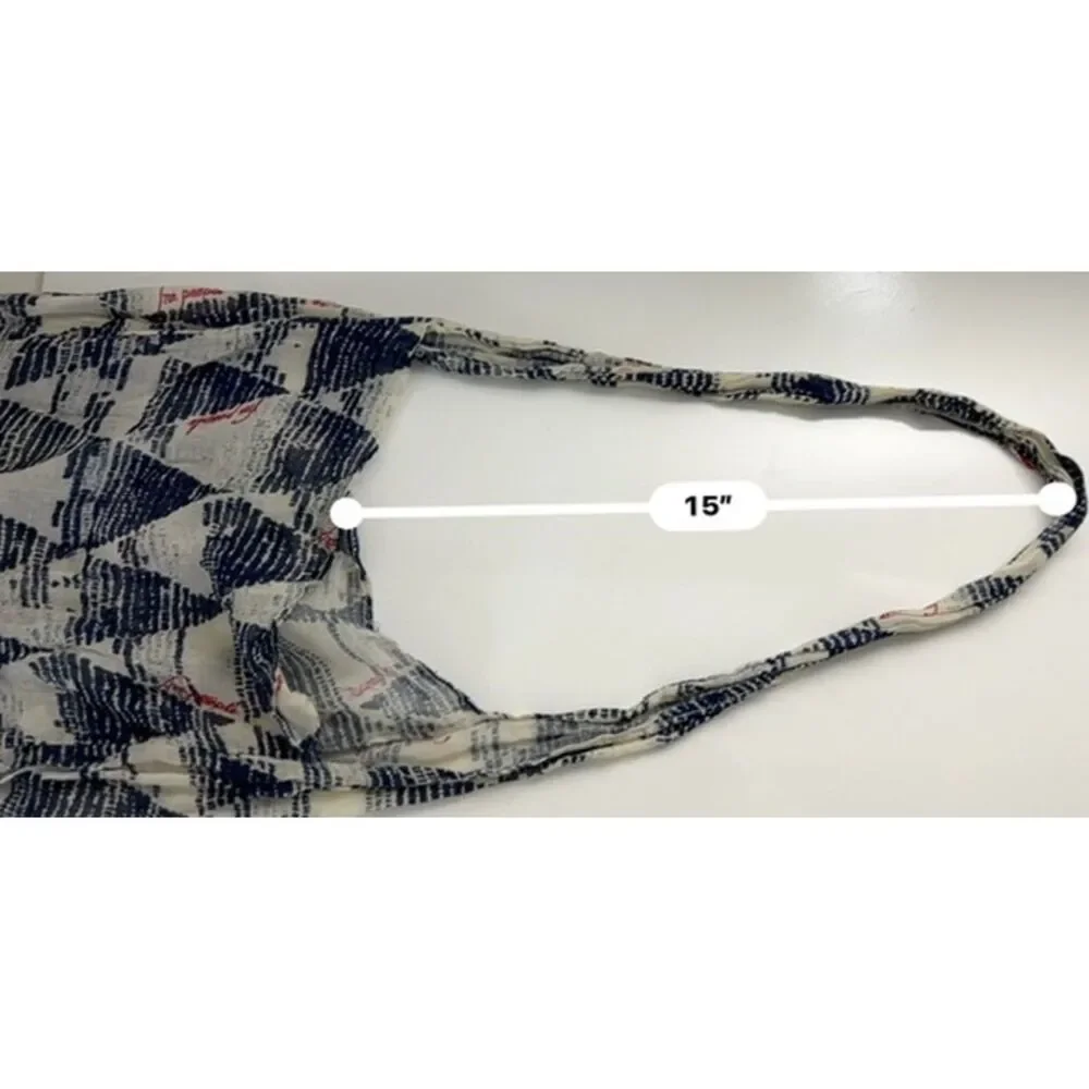 Free People sheer tote/hobo with a geometric design.